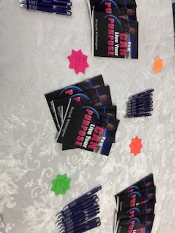 Live Your Purpose flyers on a table