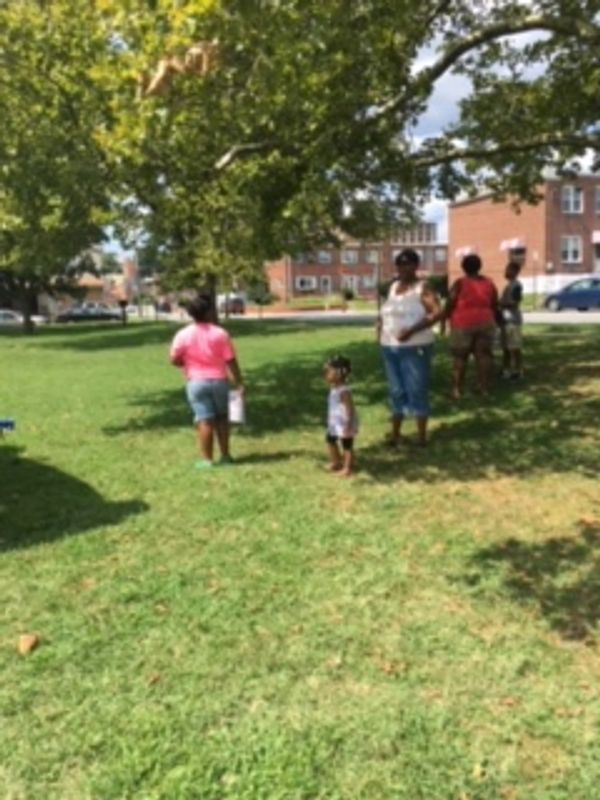 Families at a STAMP Love community day in the park